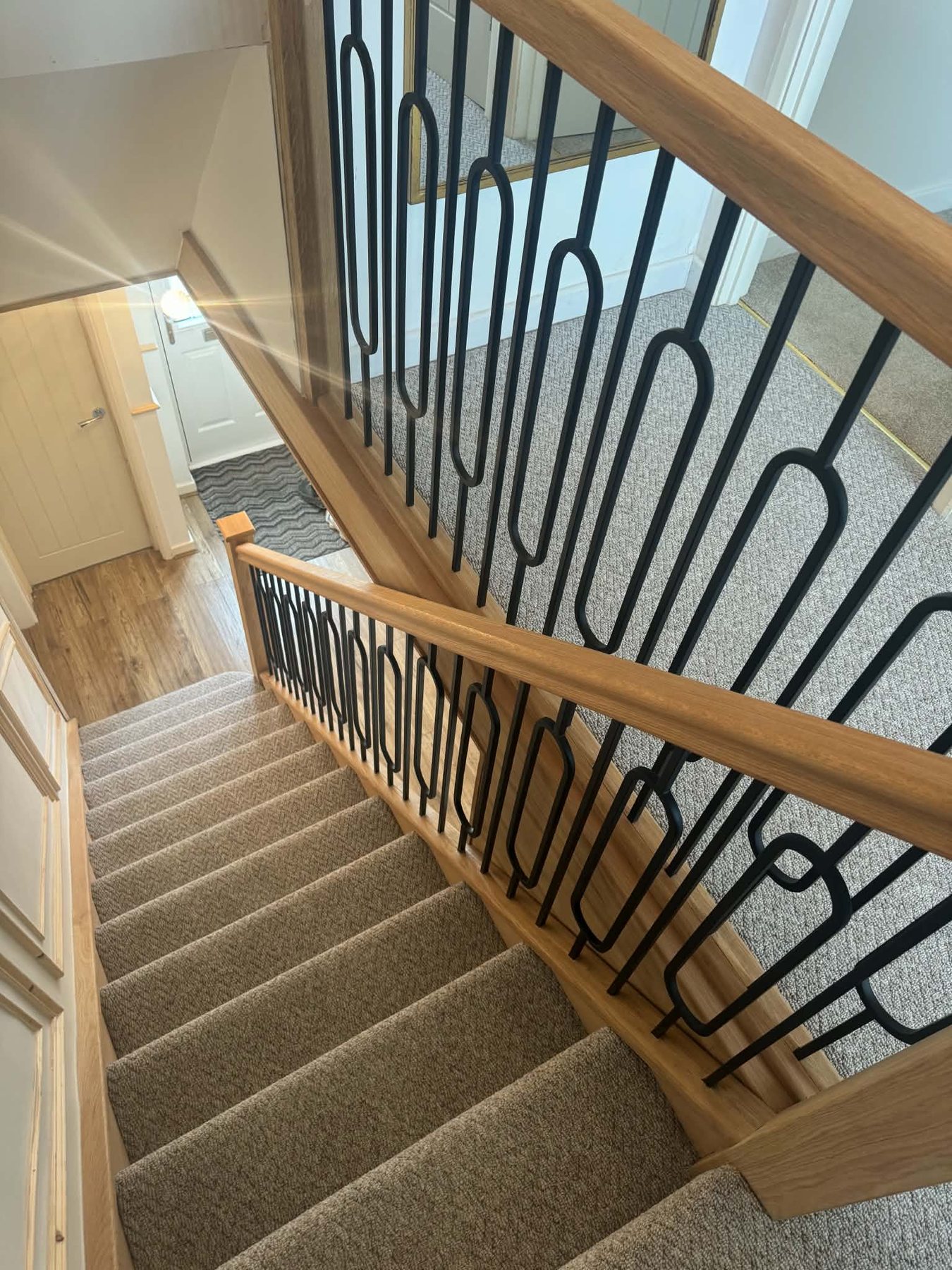 Oak handrail with black metal spindles